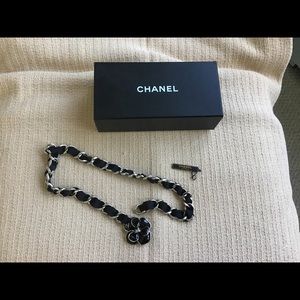 Chanel belt with camellia buckle.